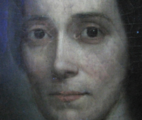 a close-up of a painting of a woman's face under ultraviolet light